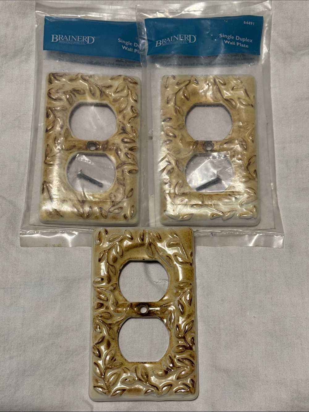 Brainerd 3 Single Duplex Ceramic Wall Plates in Toasted Almond Harvest Leaves